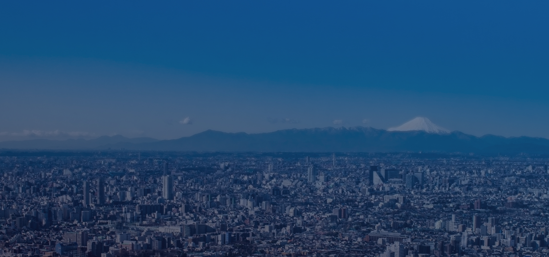 東京の街並みと富士山の画像